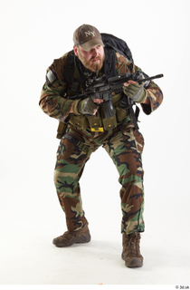 Robert Watson Crouching with Gun aiming gun standing whole body…